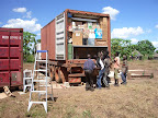Unloading lifting jacks from 1st container upon arrival in Kitgum.