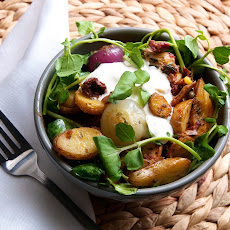 Roasted Fingerling Potatoes & Cipollini Onions with Cress, Sundried Tomatoes, Oregano, & Blue Cheese Crema