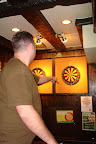 Eric plays darts better with his left hand