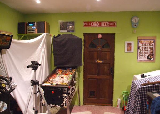 My photo-studio at home setup. A white sheet hangs next to the game, 