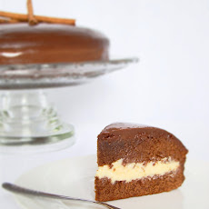 Honey Cake with White Brigadeiro Filling Covered with Chocolate Ganache