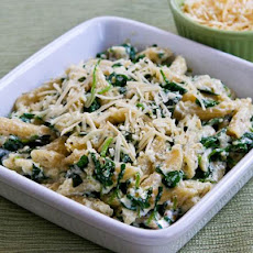 Penne Pasta with Wilted Arugula, Basil, Ricotta, and Parmesan Sauce