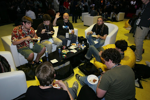 Phill waves, while everybody else enjoys the tasty food
