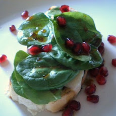 An Open Faced Sandwich of Kasseri, Spinach and Pomegranate