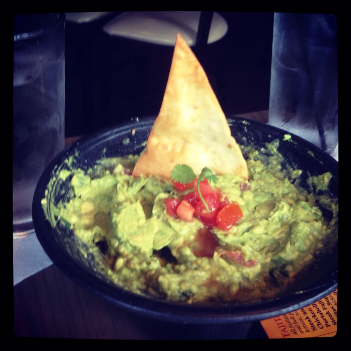 GF guacamole appetizer served with a non GF pita sticking out of it. Pita was not mentioned on the m
