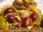 A rare treat of marinated purple baby artichokes, baby chocolate bell peppers, dehydrated green zebra tomatoes on top of nut butter spread and raw bread. Sprinkled with sea kelp, pepper, and nutritional yeast. With a squeeze of lemon to boot!