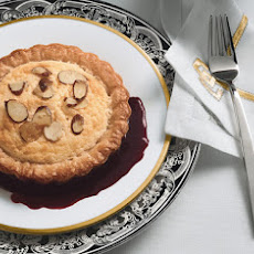 Lemon Soufflé Tartlets with Sugared Almonds and Blackberry Sauce