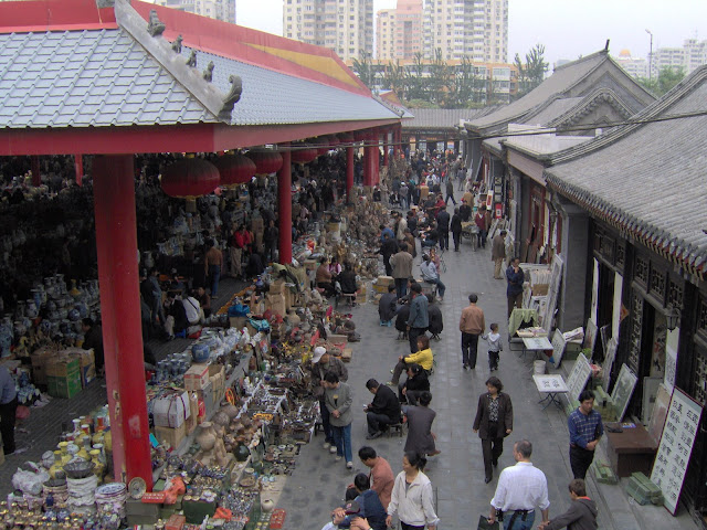 flea vendors and traditional shops sell side-by-side