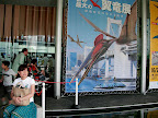 Aya in front of the sign for the pterosaur exhibiton