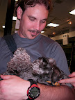 Jason holding the calm Schnauzer