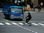I wouldn't play chicken with a big-ass truck on a tiny bicycle like that!