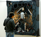 A Japanese man investigates this unusual work of art, the robot actually moved!!