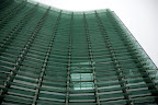 A close-up of the glass exterior of The National Art Center, Tokyo