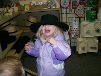 PA December 07 &ndash; Ruthie trying on an Amish hat at Country Cupboard.