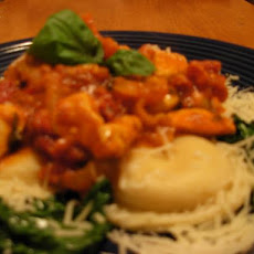 Spicy Chicken Rustica on Ravioli and Arugula