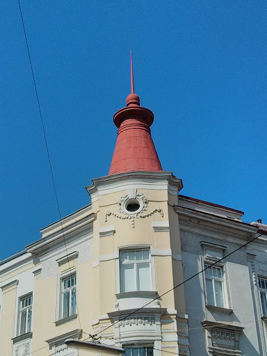 House with Pointy Red Stick on Top