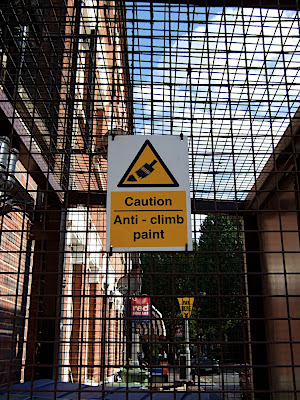 Anti-climb paint sign on a cage