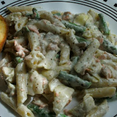 Salmon Penne With Basil Pesto Cream Sauce, Artichokes, and Asparagus