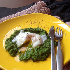 Poached egg on mint spring pea puree with truffle oil