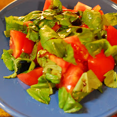 Red and Yellow Tomato Salad with Basil, Olives and Onions