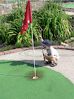 Isaac looking at his Putt