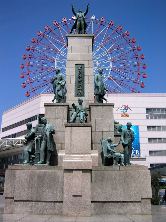The plaque for this statue reads, in part: “Satsuma, now Kagoshima, produced brilliant, far-sighted men during the Meiji Restoration (1868). In 1865, defying the Tokugawa Isolation Law, 17 courageous young students from Satsuma were smuggled to Europe and America to learn advanced Western technology. Overcoming great difficulties, they returned to become the driving force in the modernization of the feudalistic society.”