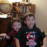 Eidan and Kai sharing my desk chair