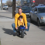 Kai and James riding a mini bike in Denver Kai and James riding a mini bike in Denver