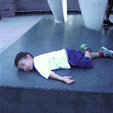 Eidan plays dead on the Awakening statue at Villanova Eidan plays dead on the Awakening statue at Villanova