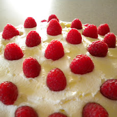Fresh Raspberries with an Almond Cream Cake Backdrop