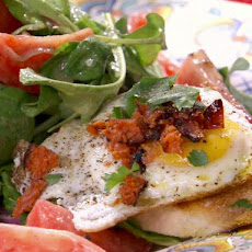 Tomato, Red Onion and Rocket Salad with Fried Egg, Grilled Chorizo and Grilled Provoleto Crostini