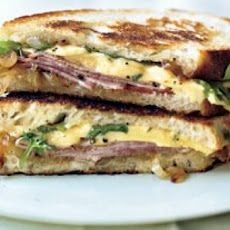 Grilled Ham and Gouda Sandwiches with Frisée and Caramelized Onions