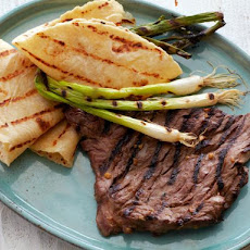 Korean-Style Marinated Skirt Steak with Grilled Scallions and Warm Tortillas