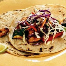 Spice-Rubbed Chicken and Vegetable Tacos with Cilantro Slaw and Chipotle Cream