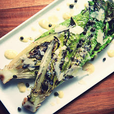 Grilled Romaine Hearts with Fried Capers & Lemon Cream