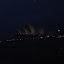 Darkness surrounds the Sydney Opera House