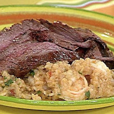 Sliced Chili Rubbed Flank Steak on Spicy Rice with Shrimp and Guacamole Stacks
