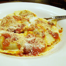 Ravioli With Tomatoes, White Beans, and Escarole