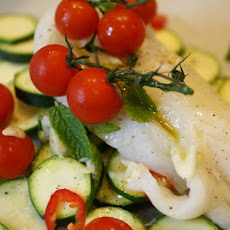 Fresh Cod in a Paper Bag with Zucchini, Tomatoes, and Mint