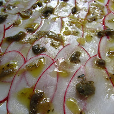 Radish Carpaccio with capers and herbs vinaigrette.