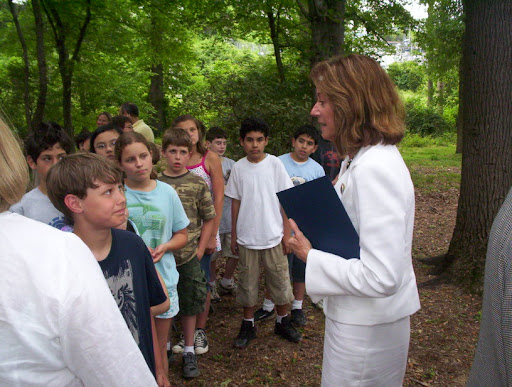Margi speaks with kids at bill signing