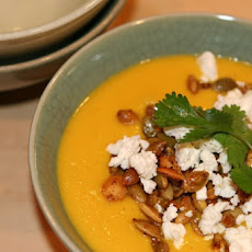 Cream of Carrot Soup with Fire-Roasted Chiles, Toasted Pepitos and Crumbled Feta