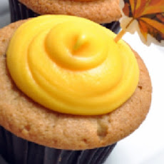 Pumpkin Cupcakes With Orange Cream Cheese Frosting