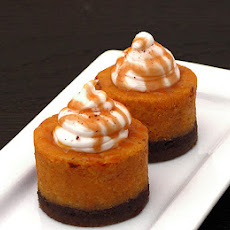 Spiced Pumpkin Cheesecake with Bourbon Whip Cream