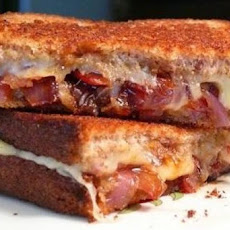 Grilled Sausage Sandwiches with Caramelized Onions and Gruyère Cheese