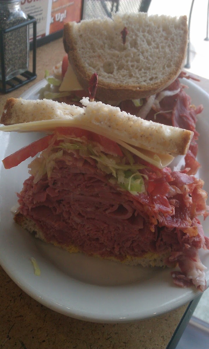 The New York Yankee 3/4 lb combo of hot corned beef and pastrami swiss mustard, and mayo on gf bread