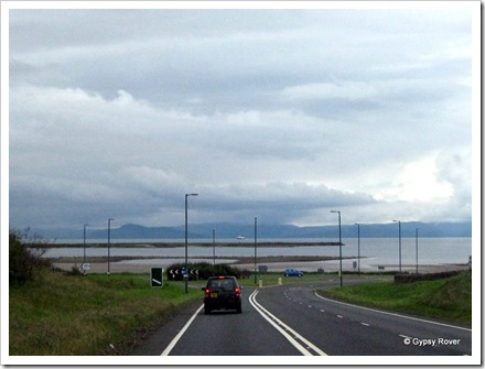 Isle of Arran hidden in cloud with a ferry crossing to Ardrossan.