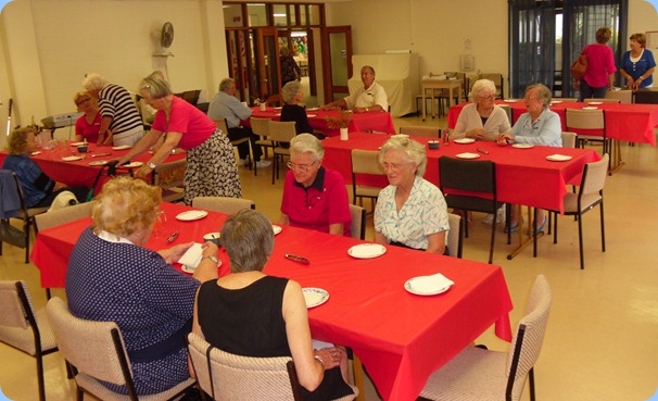 Members of St Anne's Club for the Blind preparing for lunch (and the music!)