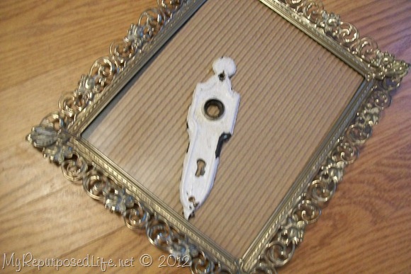ornate frame and chippy door plate