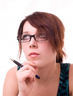 Atraente jovem mulher de negócios com óculos [www.123RF.com]